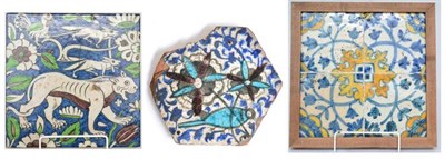 Lot 79 - A set of four faience tiles, 17th century, painted in blue and yellow with stylised foliage and...