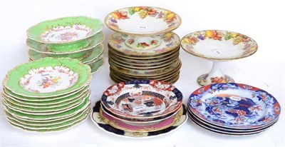 Lot 89 - ^ A Staffordshire porcelain dessert service, circa 1860, decorated with fruit and flowers on a...