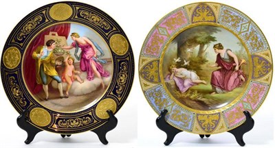 Lot 103 - A Vienna style porcelain cabinet plate, circa 1900, decorated with a painter, a classical...