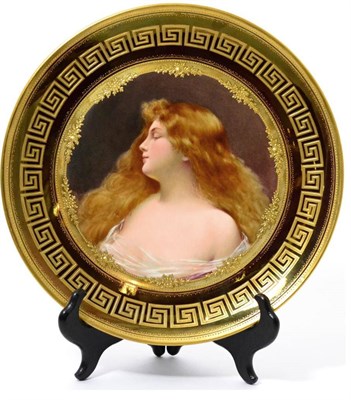 Lot 104 - A Vienna style porcelain cabinet plate, circa 1900, painted with a bust portrait of a girl,...