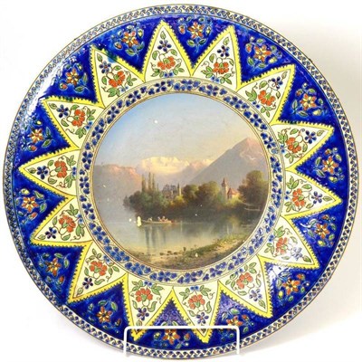 Lot 114 - An A. Born-Straub, Thoune, pottery charger painted with a Swiss lakeland scene within an...