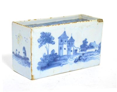 Lot 116 - An English Delft flower brick, circa 1760, of rectangular form, painted in blue with European...