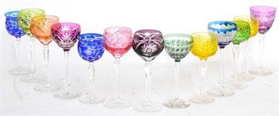 Lot 146 - ^ A Harlequin set of four hock glasses, 20th century, with flashed glass bowls and nine various...