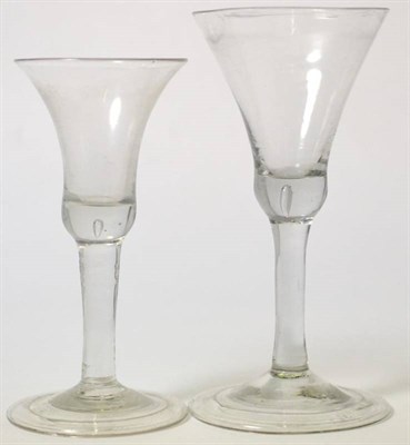 Lot 147 - A large wine glass, circa 1750, the bell shaped bowl on plain stem and folded foot, 20cm high;...