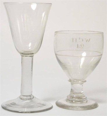 Lot 148 - A large wine glass, circa 1750, the rounded funnel bowl on plain stem, 20cm high; and a rummer, the