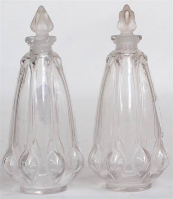 Lot 150 - ^ A pair of 1930's Lalique glass scent bottles and stoppers, of baluster form with lobed...