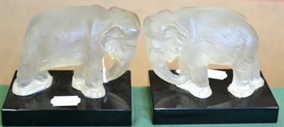 Lot 151 - A pair of Art Deco Elephant glass bookends, made by Heinrich Hoffmann, the frosted glass...