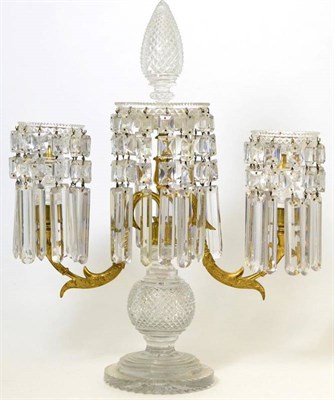 Lot 155 - A Regency gilt metal and cut glass twin light candelabrum with pinecone finial the dish sconces...