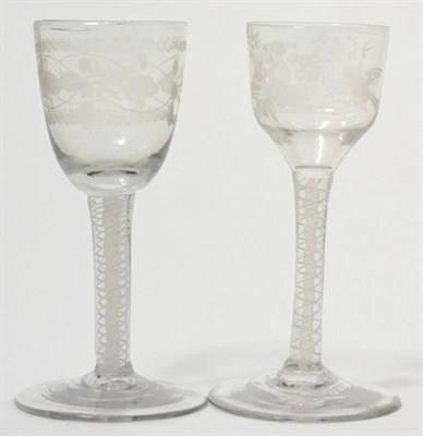 Lot 163 - A wine glass circa 1750, the ogee bowl engraved with a bird and basket of flowers, on an opaque...