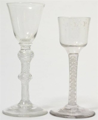 Lot 164 - A wine glass circa 1750, the rounded funnel bowl on a double knot twist stem, 16cm high and a...