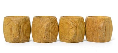 Lot 177 - Four Robert ";Mouseman"; Thompson oak napkin rings, each with carved mouse signature, 5cm