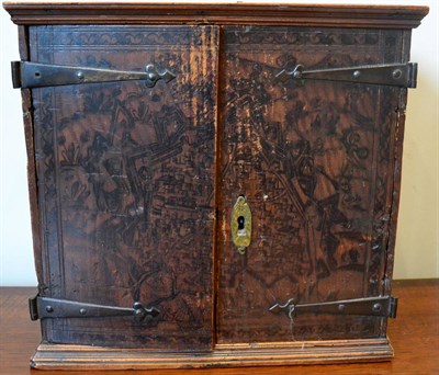 Lot 183 - A pen work decorated table cabinet, late 17th century, of rectangular form with two doors enclosing