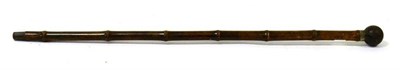 Lot 186 - A Victorian bamboo-sleeved and steel-cored walking cane by Thomas Briggs &amp; Sons, with ball knop