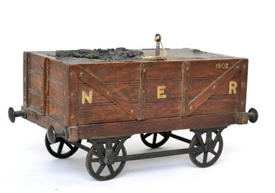 Lot 196 - A novelty table cigar box, 20th century, modelled as a NER wagon on four wheels, the hinged...