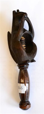 Lot 202 - A treen nut cracker, 19th century, modelled as a squirrel eating a nut, 21cm