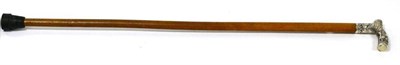 Lot 205 - A white metal mounted malacca walking cane, circa 1900, the handle decorated with a boar hunt, 94cm