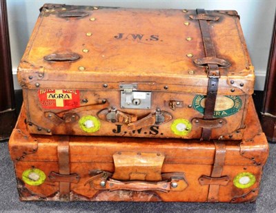 Lot 208 - A leather suitcase, initialled JWS, with shipping labels, 76cm wide; and a similar suitcase,...