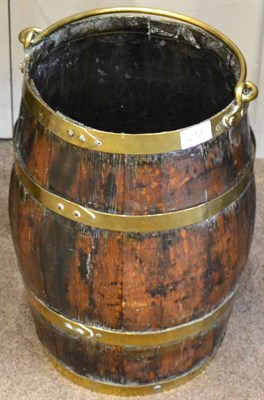 Lot 213 - A coopered barrel with brass bands and handle, 60cm high