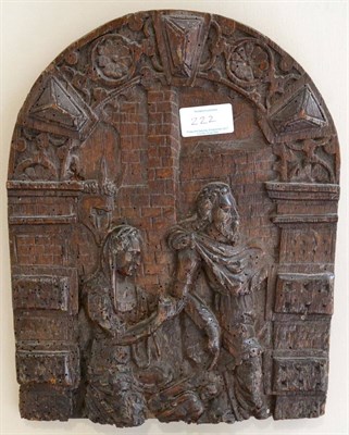 Lot 222 - A carved oak panel, 17th century, depicting the Flight to Egypt within an arched architectural...