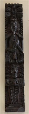 Lot 225 - A carved oak Term figure, 17th century, as a musician playing pipes over a mask and scroll,...