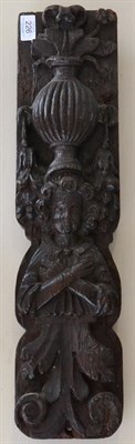 Lot 226 - A carved oak Term figure, 17th century, a fluted vase on his head, his arms crossed over a...