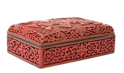 Lot 232 - A Chinese cinnabar box and cover, 19th century, rectangular form carved with foliage amongst...