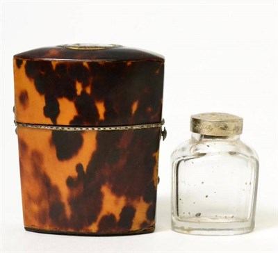 Lot 242 - A George III tortoiseshell travelling inkwell, the hinged cover set with a bust portrait of a...