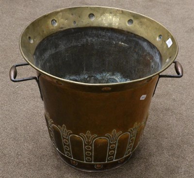 Lot 251 - A large brass and copper log bin, everted rim and twin loop handles over a gadrooned border,...