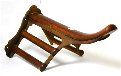 Lot 258 - A Musgrave patent cast iron and mahogany saddle rack, late 19th century, 51cm high