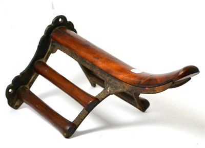 Lot 259 - A Musgrave patent cast iron and mahogany saddle rack, late 19th century, 51cm high