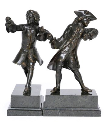 Lot 264 - A pair of bronze figures of gentleman in 18th century dress, each in active pose with hands...