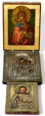 Lot 291 - A Russian icon depicting the Holy Family, with silver oklad, 14cm by 11.5cm; a similar icon...