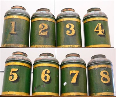 Lot 292 - A set of eight Victorian toleware tea canisters and covers, numbered one to eight on a green...