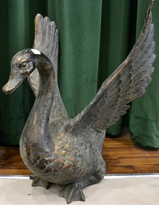 Lot 302 - A cast copper alloy figure of a swan, with wings raised, 65cm high