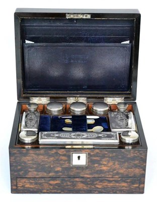 Lot 306 - A Victorian coromandel travelling dressing box, a hinged cover with mother-of-pearl plaque...