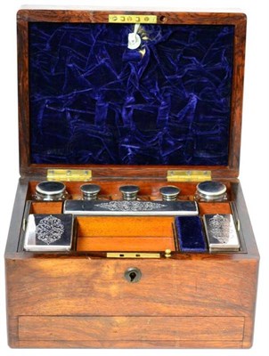 Lot 308 - A Victorian rosewood travelling vanity case, of rectangular form, the hinged cove set with a...