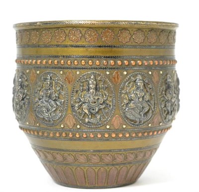 Lot 325 - An Indian copper alloy cache pot, 19th century, set with white metal plaques depicting various...