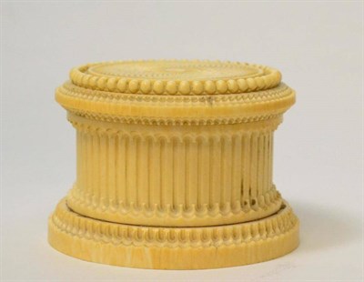 Lot 327 - An ivory box and cover, early 19th century, of circular form with engine turned decoration, 9cm...