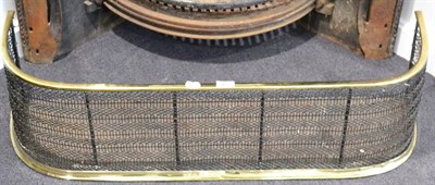 Lot 408 - A Victorian brass and wirework fender, 98cm wide