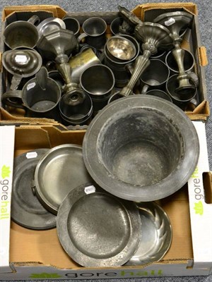 Lot 414 - Two pairs of pewter candlesticks, a pewter hot warming plate, a quantity of pewter mugs,...