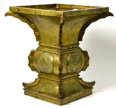 Lot 420 - A Chinese bronze Gu, in archaic style, of square section cast with foliate roundels, 31cm high