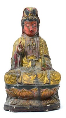 Lot 422 - A Chinese carved, painted and gilt figure of Guanyin in Ming style, cross legged holding a...