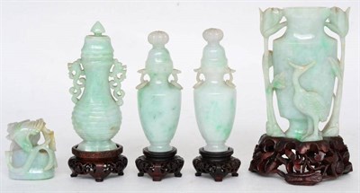 Lot 428 - A Chinese jadeite vase and cover of baluster form carved and pierced with foliage, 16.5cm high,...