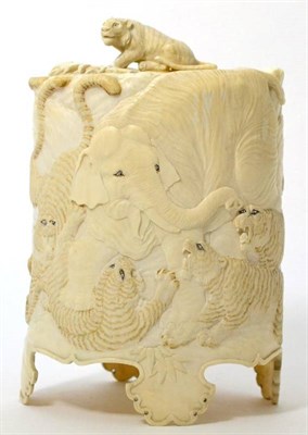 Lot 452 - A Japanese ivory tusk vase and cover, Meiji period, carved with tigers and an elephant, 22cm high