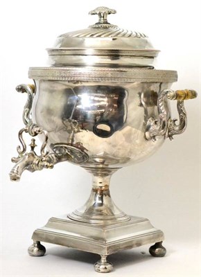 Lot 475 - A 19th century silver plated tea urn, circular with twin handles on square pedestal foot and...