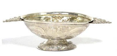 Lot 481 - A Dutch silver twin handled brandy bowl, maker's mark K.R, Leeuwarden, date letter N, repoussé...