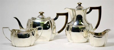 Lot 482 - A four piece silver tea and coffee service, Thomas Bradbury and Sons, Sheffield, 1935, shaped...