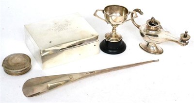 Lot 502 - A group of silver items, comprising: an Asprey silver shoe horn, London 1913; an Asprey table...