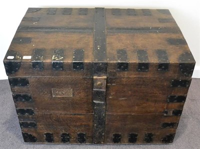 Lot 505 - A large metal bound oak silver chest, with two pairs of carrying handles and hinged cover on...