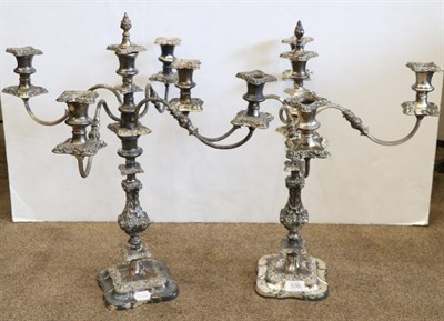 Lot 509 - A pair of 19th century silver plated five light candelabra, with four reeded branches on...